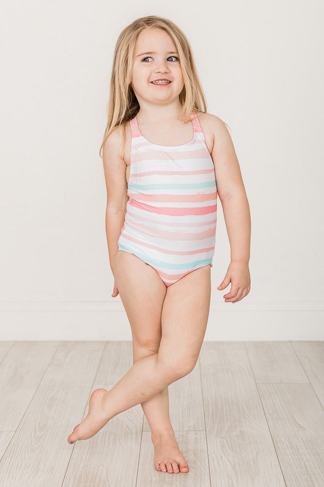 Little girl in one cheap piece swimsuit