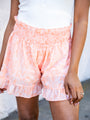 Lost In The Moment Orange Smocked Waist Ruffle Hem Printed Shorts FINAL SALE